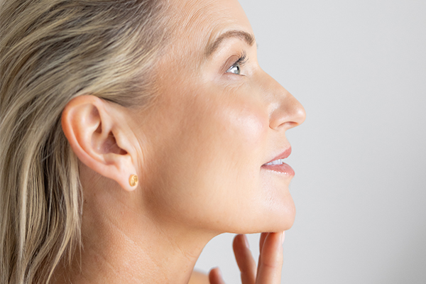 Woman with hands on her face