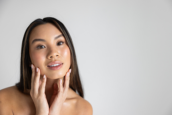 Woman with hands on her face