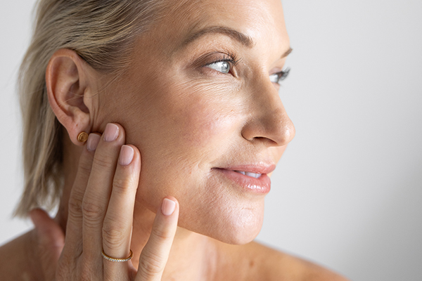 Woman with hands on her face
