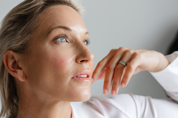Woman with hands on her face
