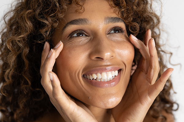Woman with hands on her face
