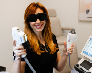 Woman holding up BBL and MOXI tools